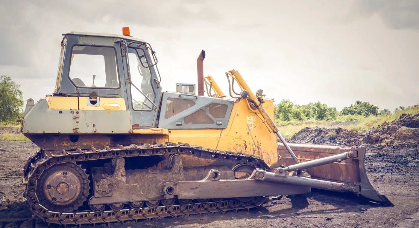 A bulldozer on a dirt job site