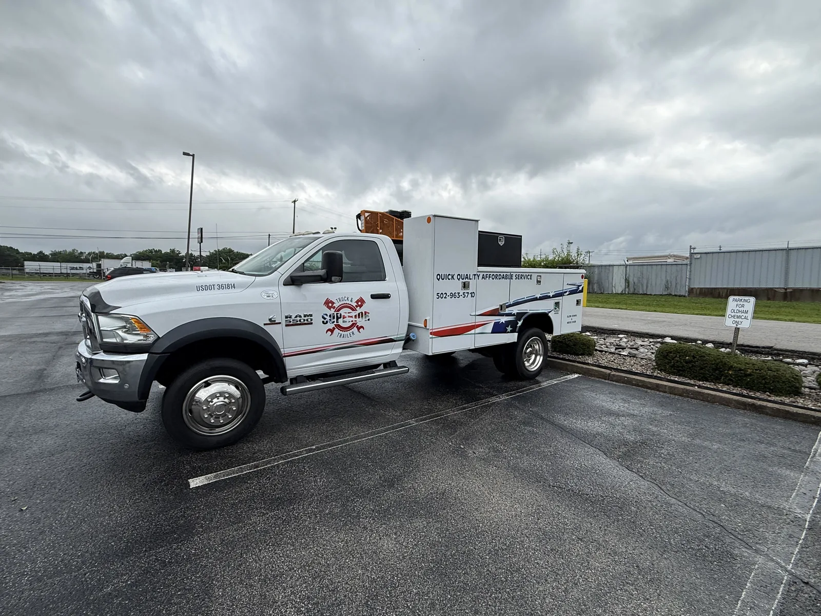 A Superior Truck & Trailer service truck in a parking lot